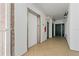 Well-lit hallway featuring tile flooring, elevator access, and convenient access to the unit entrance at 1586 Gulf Blvd # 2502, Clearwater, FL 33767