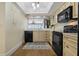 Well-appointed kitchen featuring custom cabinetry, modern black appliances, and stylish countertops at 1586 Gulf Blvd # 2502, Clearwater, FL 33767