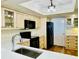 Well-lit kitchen features custom cabinets, black appliances, and marble countertops, offering a blend of style and functionality at 1586 Gulf Blvd # 2502, Clearwater, FL 33767