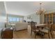 Bright and open living room with hardwood floors, large windows showcasing the ocean view, and a fireplace at 1586 Gulf Blvd # 2502, Clearwater, FL 33767