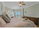 Comfortable bedroom with a king-size bed, balcony access, and beautiful views at 1586 Gulf Blvd # 2502, Clearwater, FL 33767