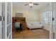 Cozy home office with hardwood floors, built-in desk, and comfortable seating, perfect for remote work at 1586 Gulf Blvd # 2502, Clearwater, FL 33767
