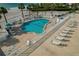 Inviting community pool with plenty of lounge chairs and ocean views at 1586 Gulf Blvd # 2502, Clearwater, FL 33767