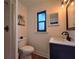 Bathroom features a mosaic tiled shower, toilet, and vanity with black hardware at 1608 20Th W Ave, Palmetto, FL 34221