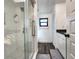 Bathroom featuring a stand-up shower with white subway tile and a glass enclosure at 1608 20Th W Ave, Palmetto, FL 34221