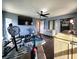 Bedroom featuring exercise equipment, sleek fan, closet and wood flooring at 1608 20Th W Ave, Palmetto, FL 34221