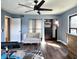 Bedroom showcasing closet, ceiling fan, wood floors, and natural light at 1608 20Th W Ave, Palmetto, FL 34221