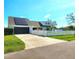 Charming home featuring a white fence, solar panels, and well-maintained landscaping at 1608 20Th W Ave, Palmetto, FL 34221