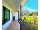 Charming front porch with brick flooring, beautiful landscaping, and tasteful decor at 1608 20Th W Ave, Palmetto, FL 34221