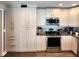 Well-lit kitchen featuring stainless steel appliances and abundant cabinet storage solutions at 1608 20Th W Ave, Palmetto, FL 34221