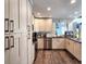 Well-lit kitchen with stainless steel appliances, granite counters and updated cabinets at 1608 20Th W Ave, Palmetto, FL 34221