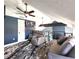 Cozy living space with blue walls, ceiling fan, accent rug, and comfortable seating at 1608 20Th W Ave, Palmetto, FL 34221