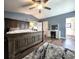Spacious main bedroom with a dark wood bed, an ensuite bathroom, and a walk-in closet at 1608 20Th W Ave, Palmetto, FL 34221