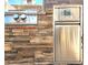 Outdoor kitchen with stainless steel appliances and beautiful stone accents at 1608 20Th W Ave, Palmetto, FL 34221