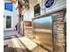 Outdoor kitchen features a stainless steel refrigerator and a beer tap at 1608 20Th W Ave, Palmetto, FL 34221