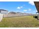 Expansive backyard featuring a vinyl privacy fence, offering plenty of space for outdoor activities and entertaining at 16632 Sunburst Lake St, Wimauma, FL 33598