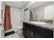 Bathroom featuring a combination bathtub and shower with toilet and vanity sink at 16632 Sunburst Lake St, Wimauma, FL 33598