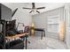 Bedroom with desk, chair, recording and sound equipment, and a window with natural light at 16632 Sunburst Lake St, Wimauma, FL 33598