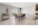 Bright dining area with sliding glass doors, a dining table with chairs, and tile flooring at 16632 Sunburst Lake St, Wimauma, FL 33598