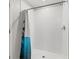 Bright shower featuring white tiled walls and a shower curtain at 16632 Sunburst Lake St, Wimauma, FL 33598
