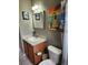 This full bathroom features a single sink and vanity with beach themed decor at 17430 Spring Valley Rd, Dade City, FL 33523