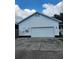 Large two-car garage providing ample space for vehicles and storage at 17430 Spring Valley Rd, Dade City, FL 33523