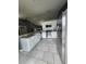 Modern kitchen with stainless steel appliances, granite countertops, and white cabinetry at 17430 Spring Valley Rd, Dade City, FL 33523