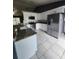 Stylish kitchen featuring granite countertops, stainless steel appliances and white cabinets at 17430 Spring Valley Rd, Dade City, FL 33523