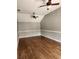 Spacious room featuring hardwood floors and ceiling fans at 17430 Spring Valley Rd, Dade City, FL 33523