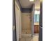 A bathroom featuring a tiled shower stall at 17430 Spring Valley Rd, Dade City, FL 33523
