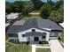 An aerial view reveals this home's new roof, landscaping and freshly sealed driveway at 1762 Fulton Ave, Clearwater, FL 33755