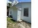 Home's backyard with a door that provides an entrance to the exterior at 1762 Fulton Ave, Clearwater, FL 33755