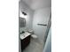 Bathroom featuring a modern sink and shower with tiled floors at 1762 Fulton Ave, Clearwater, FL 33755