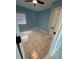 Bedroom with blue walls and large window letting in lots of light; marble-pattern tile floors at 1762 Fulton Ave, Clearwater, FL 33755