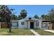 Charming single-story home featuring a well-maintained lawn and inviting front entrance at 1762 Fulton Ave, Clearwater, FL 33755