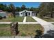 Charming single-story home with a well-maintained front yard and a neatly paved walkway leading to the entrance at 1762 Fulton Ave, Clearwater, FL 33755