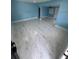 A living room featuring new tile flooring, updated paint, and plenty of natural light at 1762 Fulton Ave, Clearwater, FL 33755