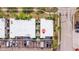 Aerial view displays community with nearby parking and streets with palm trees at 1799 N Highland Ave # 3, Clearwater, FL 33755