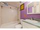 Bathroom features a standard toilet, vanity and shower and bath tub at 1799 N Highland Ave # 3, Clearwater, FL 33755