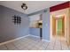 Dining room area featuring tile flooring, and breakfast bar at 1799 N Highland Ave # 3, Clearwater, FL 33755