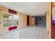 Living room features tile floor, large window and neutral walls at 1799 N Highland Ave # 3, Clearwater, FL 33755
