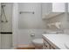 Bathroom featuring shower, toilet, wainscotting, and towel rack at 1828 Foxhunt Dr # A, Sun City Center, FL 33573