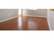 Bedroom featuring hardwood floors, one window, and neutral paint at 1828 Foxhunt Dr # A, Sun City Center, FL 33573