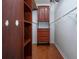 Walk-in closet with custom wood shelves and drawers for organized storage at 1828 Foxhunt Dr # A, Sun City Center, FL 33573