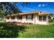 Charming single-story home with red shutters and well-maintained landscaping at 1828 Foxhunt Dr # A, Sun City Center, FL 33573