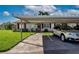 Attractive home with covered parking, manicured lawn, and convenient assigned parking spot at 1828 Foxhunt Dr # A, Sun City Center, FL 33573