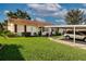 Charming single-story home with well-maintained lawn, covered parking and red shutters at 1828 Foxhunt Dr # A, Sun City Center, FL 33573