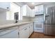 Well-equipped kitchen with stainless steel appliances and ample counter space at 1828 Foxhunt Dr # A, Sun City Center, FL 33573
