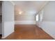 Bright living room boasts wood floors, fresh paint, and ample natural light at 1828 Foxhunt Dr # A, Sun City Center, FL 33573