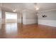 Spacious living area with ceiling fans and wood-look flooring, ready for your personal touches at 1828 Foxhunt Dr # A, Sun City Center, FL 33573